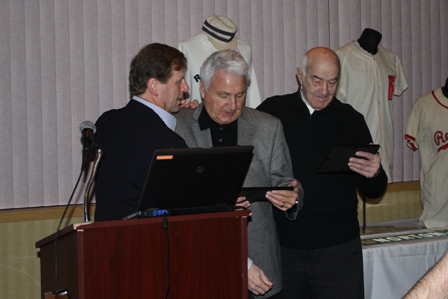 Emcee Scott Pitoniak presents Johnny Antonelli and Joe Altobelli framed RBHS "lifetime membership" cards.