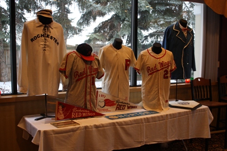 A display of Red Wings' and replica jerseys of early Rochester baseball teams served as a back drop for the events