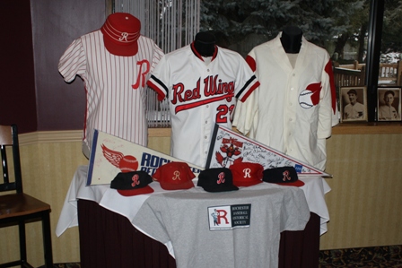 Another table displayed Red Wings jerseys, hats and an RBHS t-shirt